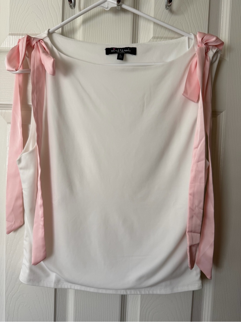 white muscle tee with pink tie straps by socialite